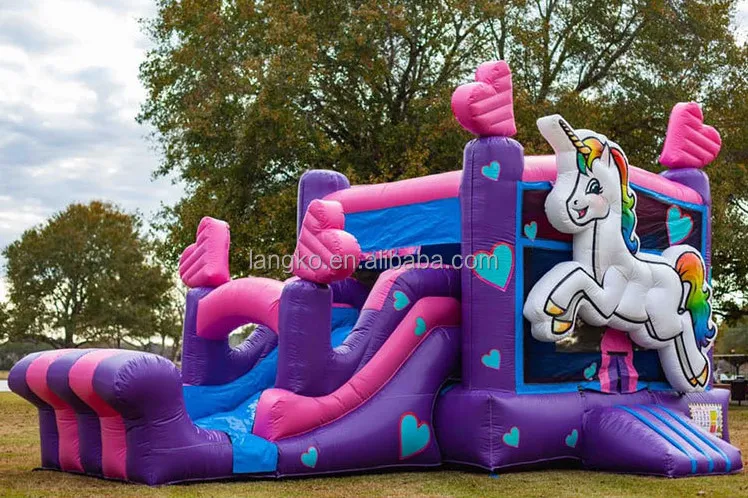 Unicorn bouncy castle with slide for hire