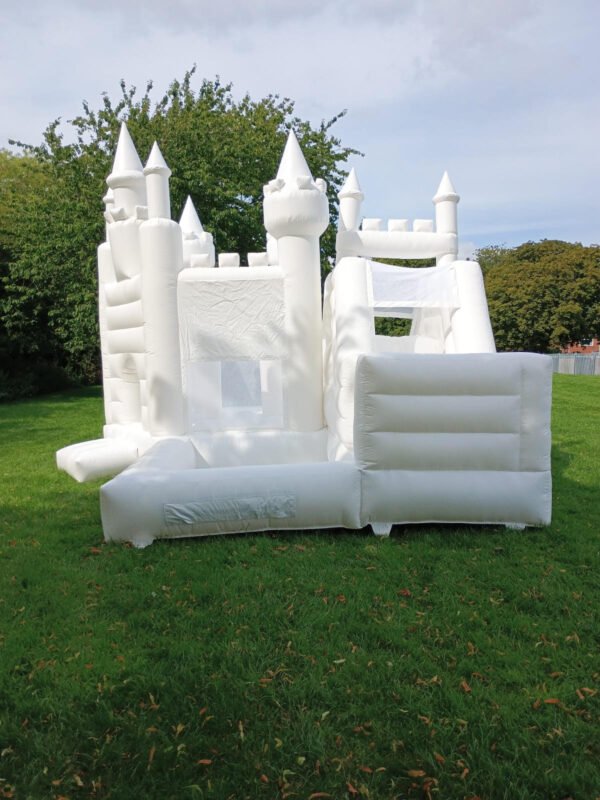 white bouncy castle with slide and ball pit