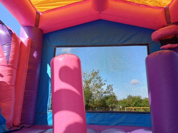 Unicorn bouncy castle with slide for hire