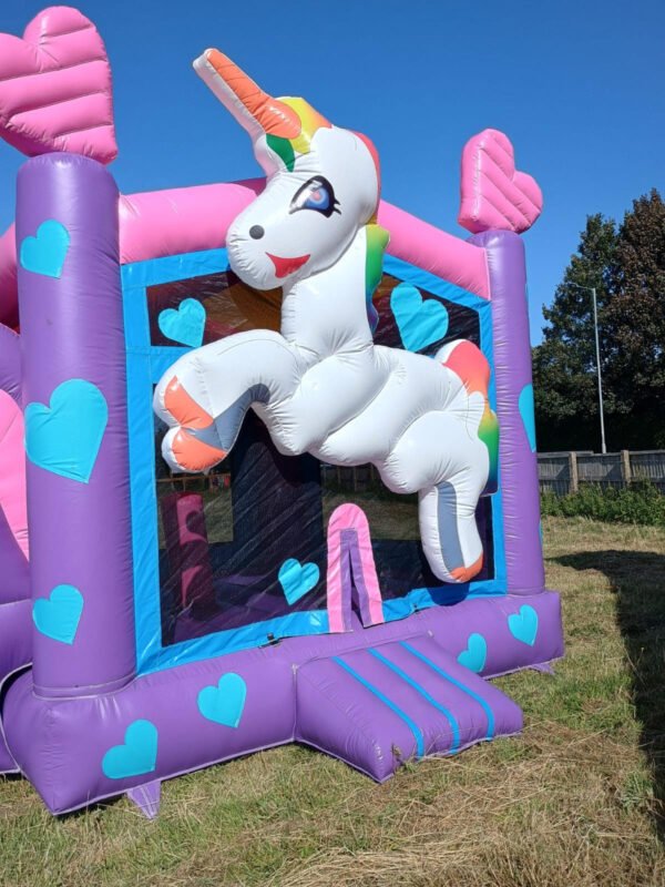 unicorn bouncy castle with slide for hire