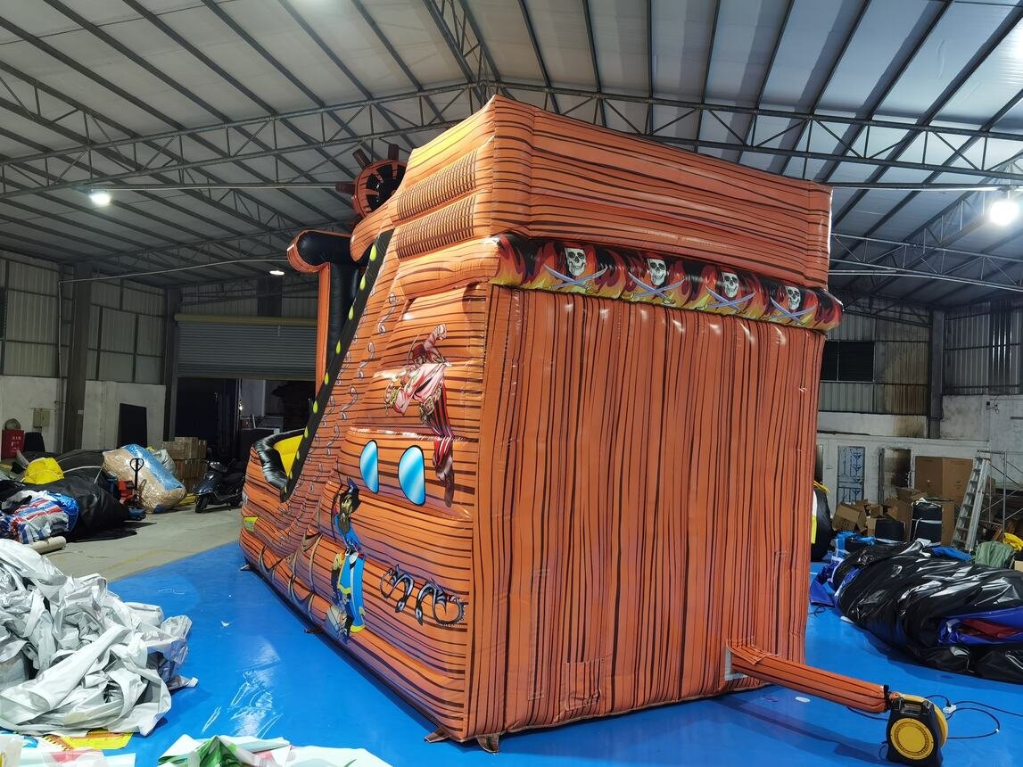 pirate ship bouncy castle with slide to hire