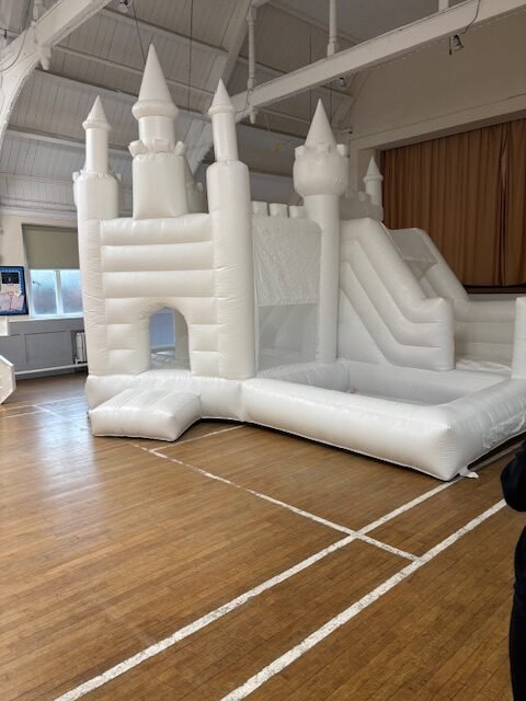 white bouncy castle with slide and ball pit to hire