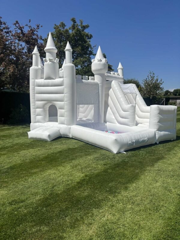 white bouncy castle with slide and ball pit