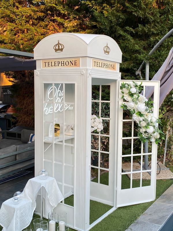 White telephone box audio guestbook