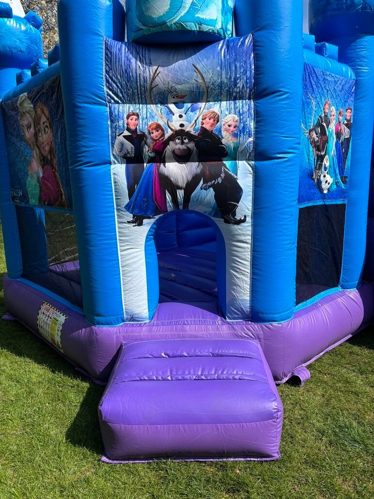 Front view of Frozen bouncy castle showing Elsa, Anna, Olaf characters