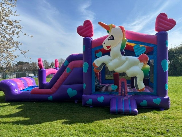 Magical unicorn bouncy castle with slide for hire in Beverly - perfect for kids birthday parties and events