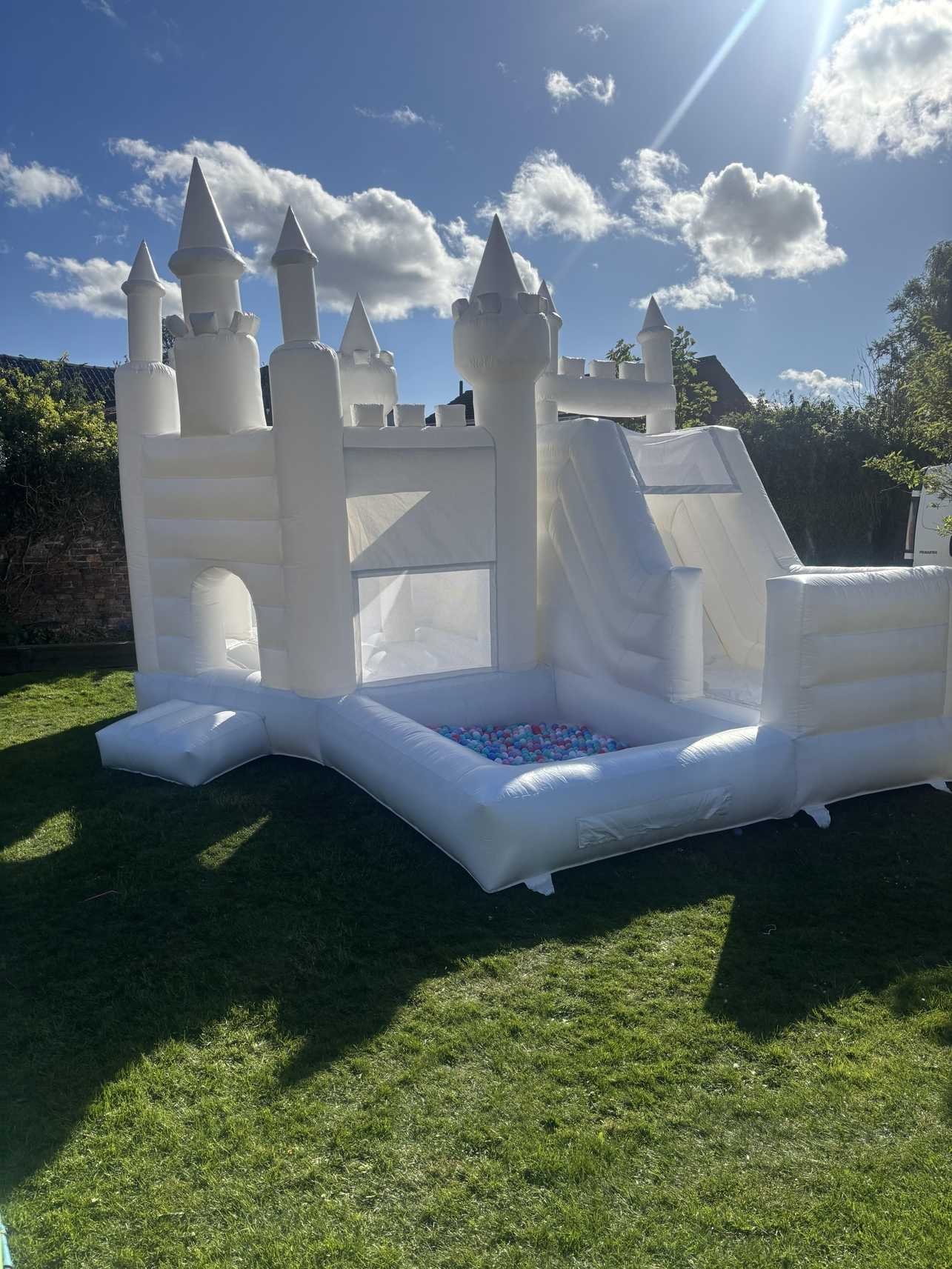 White bouncy castle with slide and ball pit for indoor hire in Hull - children's entertainment