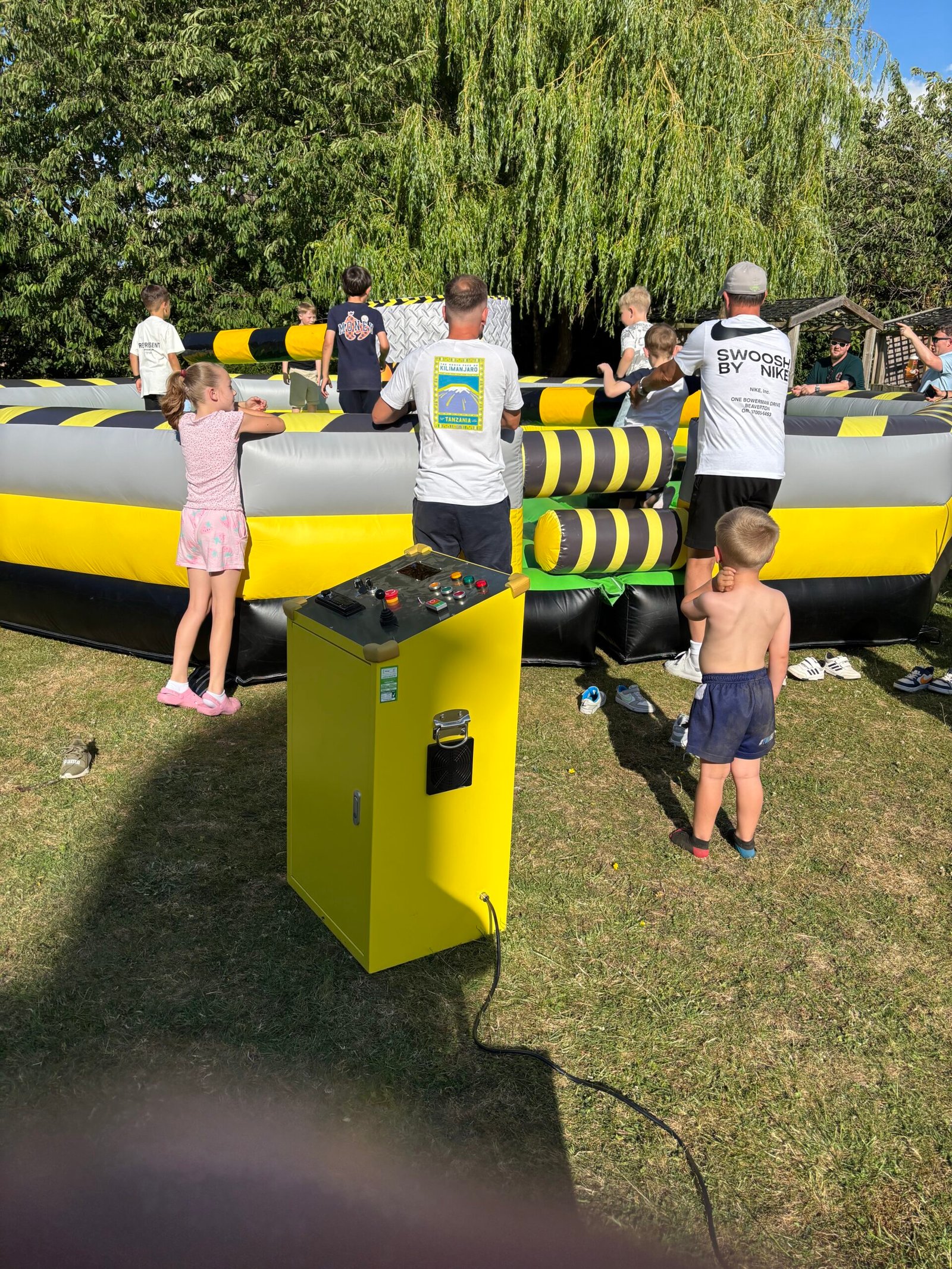 Kids and families enjoying Total Wipeout hire at community event