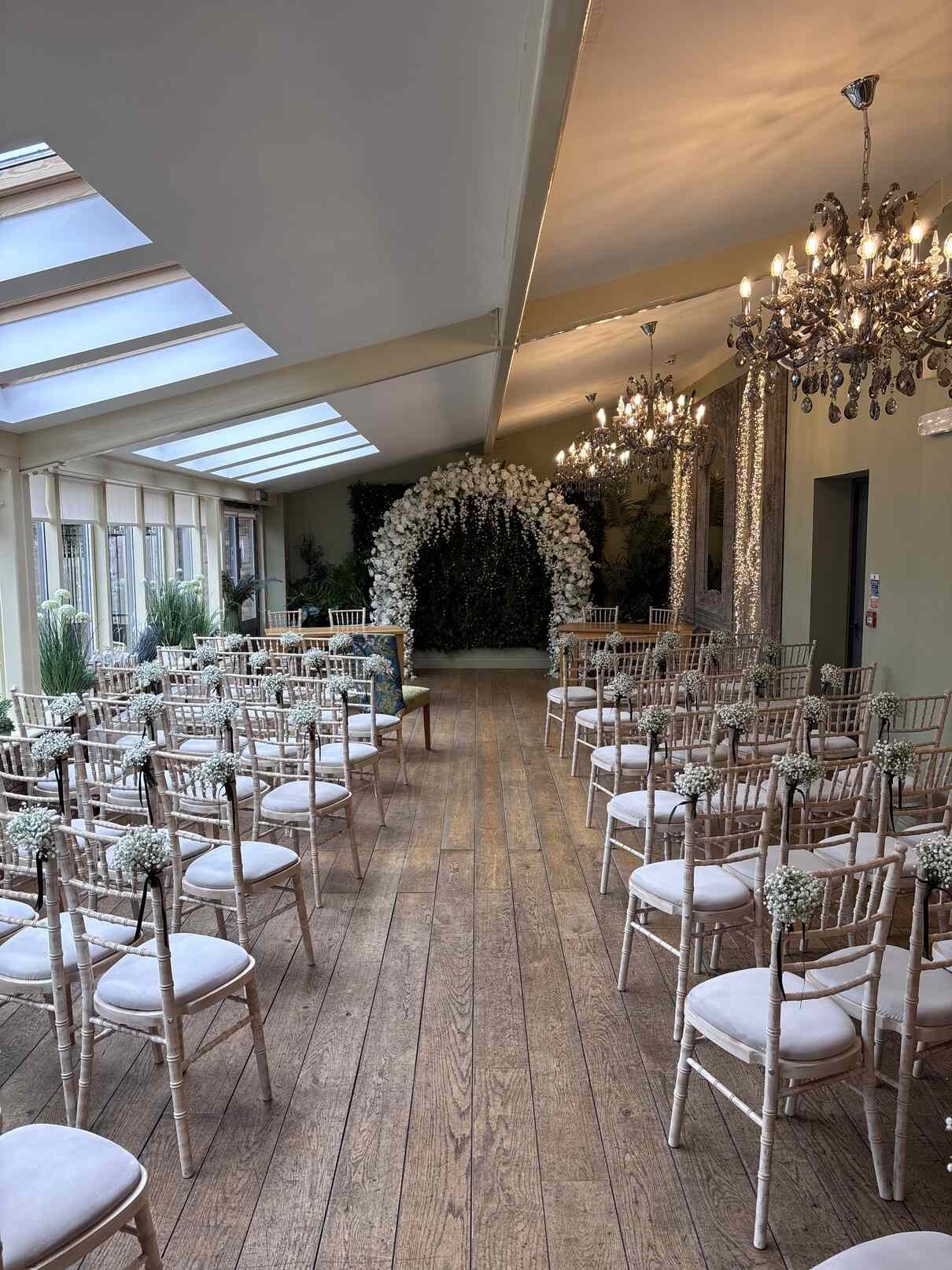Luxury white floral arch with cascading roses and flowers for wedding hire — Humber Events Company, Hull